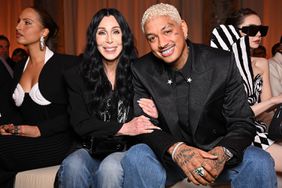 Singer Cher and Alexander Edwards attend the Balmain Womenswear Fall/Winter 2024-2025 show as part of Paris Fashion Week on February 28, 2024