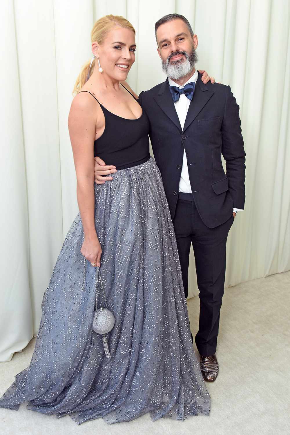 WEST HOLLYWOOD, CA - MARCH 04: Busy Philipps (L) and Marc Silverstein attend the 26th annual Elton John AIDS Foundation Academy Awards Viewing Party with cocktails by Clase Azul Tequila at The City of West Hollywood Park on March 4, 2018 in West Hollywood, California. (Photo by Vivien Killilea/Getty Images for Clase Azul)