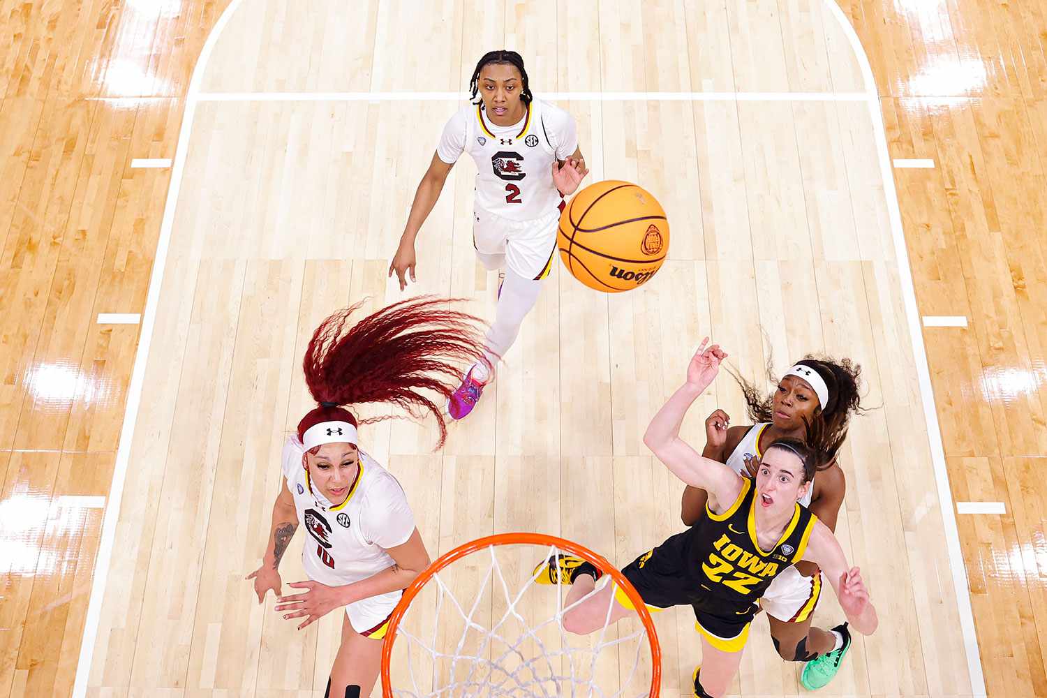 CLEVELAND, OHIO - APRIL 07: Caitlin Clark #22 of the Iowa Hawkeyes looks at the ball during the game against the South Carolina Gamecocks during the NCAA Women's Basketball Tournament Final Four National Championship game at Rocket Mortgage Fieldhouse on April 7, 2024 in Cleveland, Ohio.