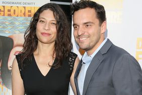 Jake Johnson, right, and his wife Erin Payne attend the premiere of 'Digging for Fire' on August 13, 2015 in Hollywood, California