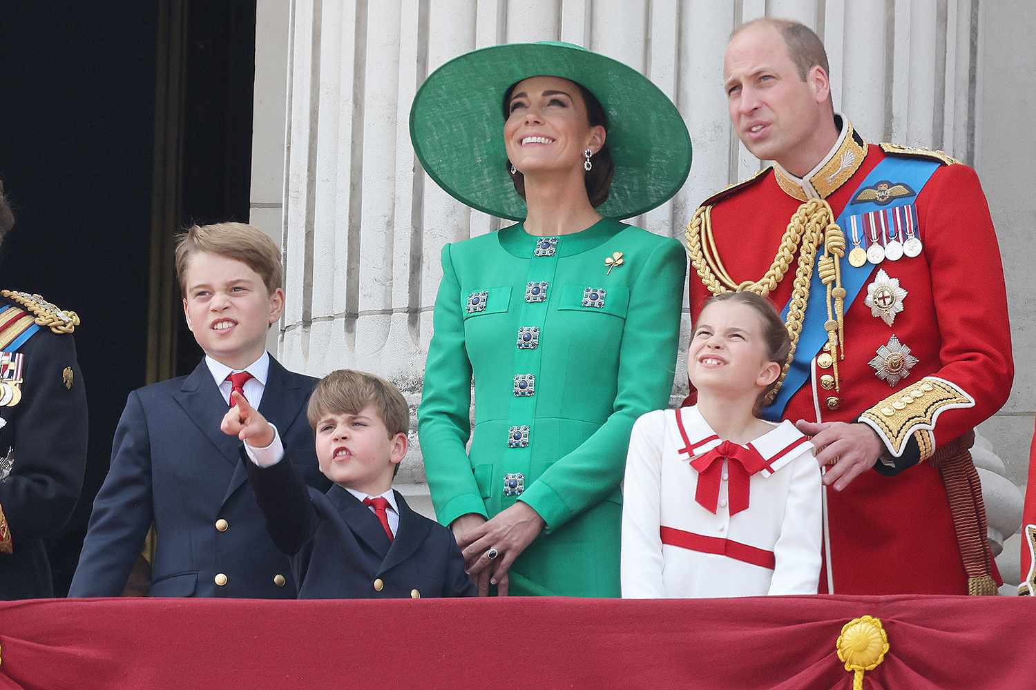 Prince George of Wales, Prince Louis of Wales, Princess Charlotte of Wales, Catherine, Princess of Wales and Prince William, Prince of Wales stand on the balcony of Buckingham Palace to watch a fly-past of aircraft by the Royal Air Force during Trooping the Colour 