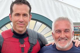 Ryan Reynolds poses in his deadpool costume with Paul Hollywood