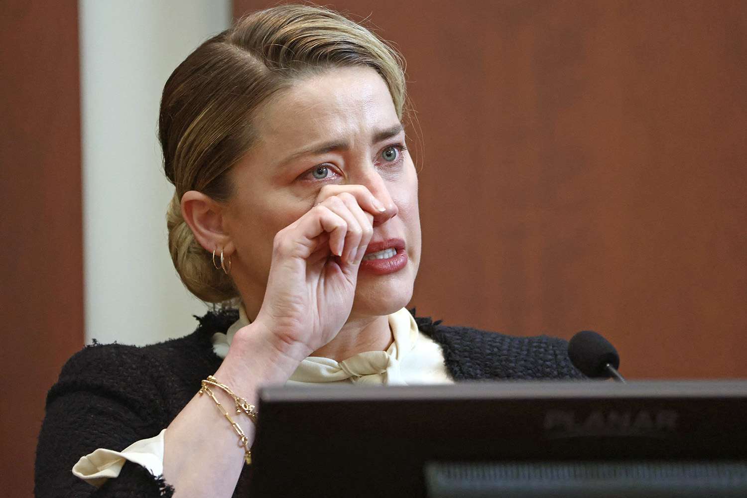 US actress Amber Heard testifies at the Fairfax County Circuit Courthouse in Fairfax, Virginia, on May 5, 2022. - Actor Johnny Depp is suing ex-wife Amber Heard for libel after she wrote an op-ed piece in The Washington Post in 2018 referring to herself as a public figure representing domestic abuse. (Photo by JIM LO SCALZO / POOL / POOL / AFP) (Photo by JIM LO SCALZO / POOL/POOL/AFP via Getty Images)