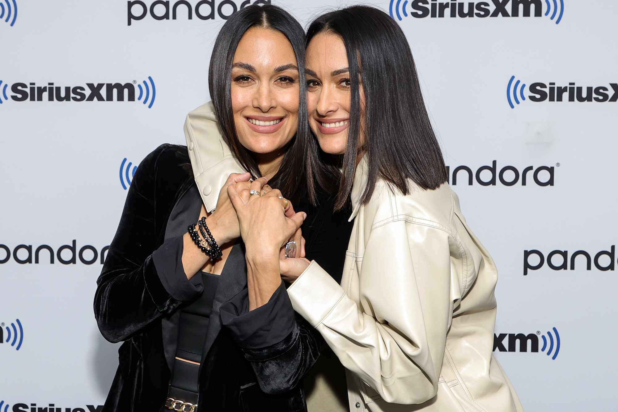 Brie Bella (L) and Nikki Bella attend SiriusXM's Town Hall With The Bella Twins at SiriusXM Studios on November 19, 2021 in New York City.