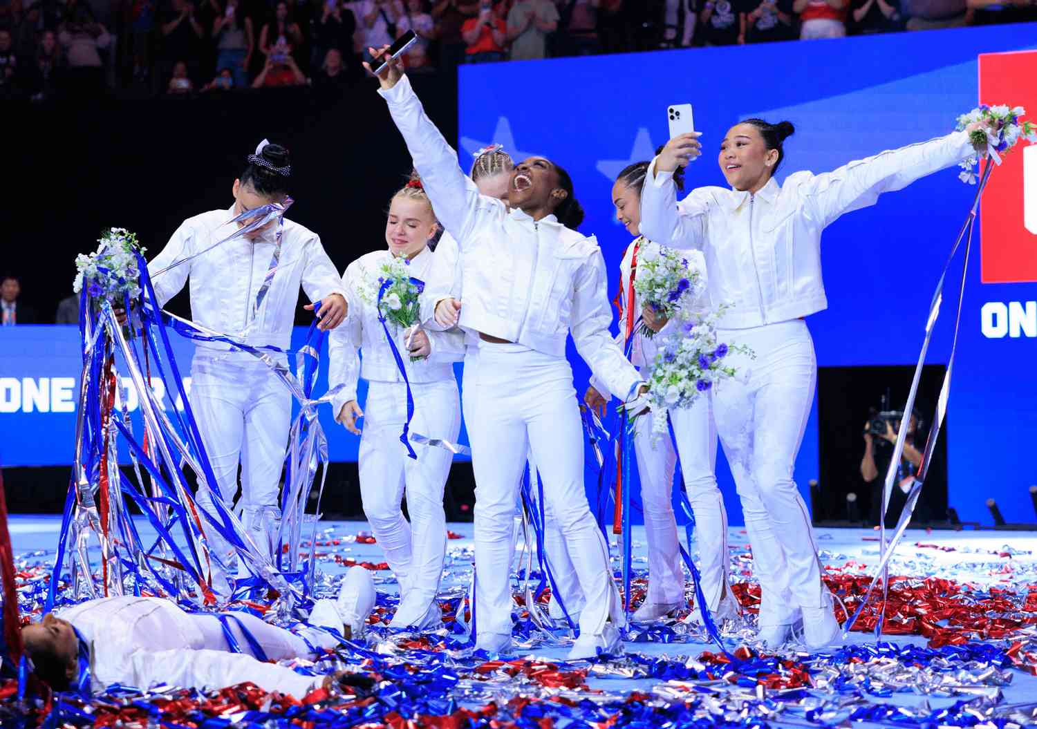 Jordan Chiles, Leanne Wong (alternate), Joscelyn Roberson (alternate), Jade Carey, Simone Biles, Hezly Rivera, and Suni Lee stand after being named at the U.S. Olympic Team for women's gymnastics at Target Center in Minneapolis, United States on June 30, 2024