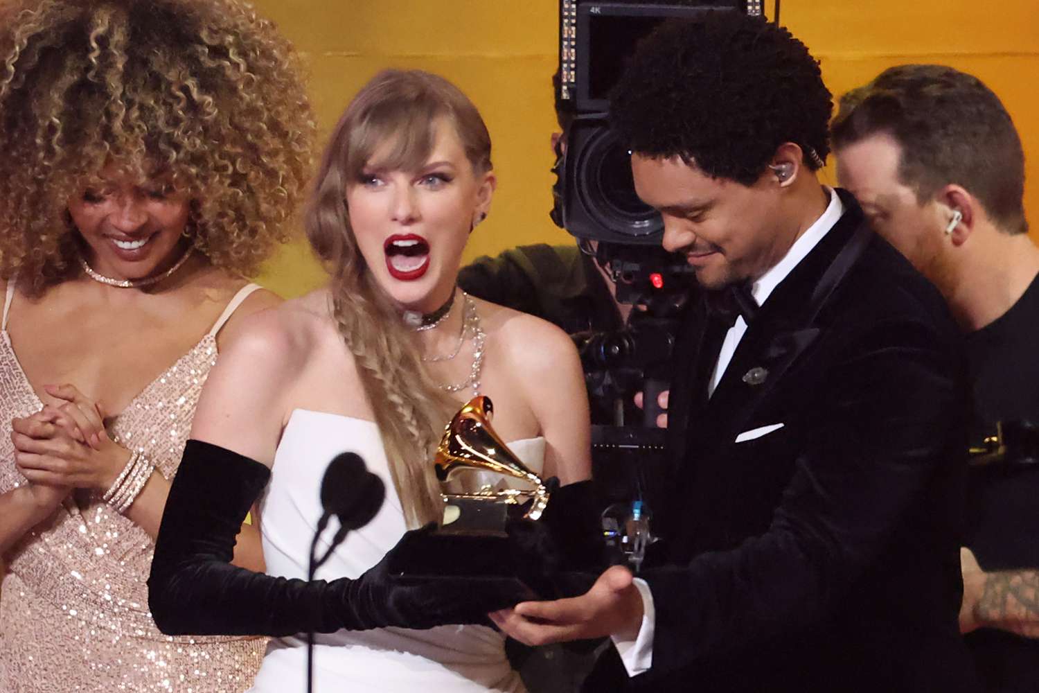 Taylor Swift accepts the "Best Pop Vocal Album" award for "Midnights" from Trevor Noahonstage during the 66th GRAMMY Awards