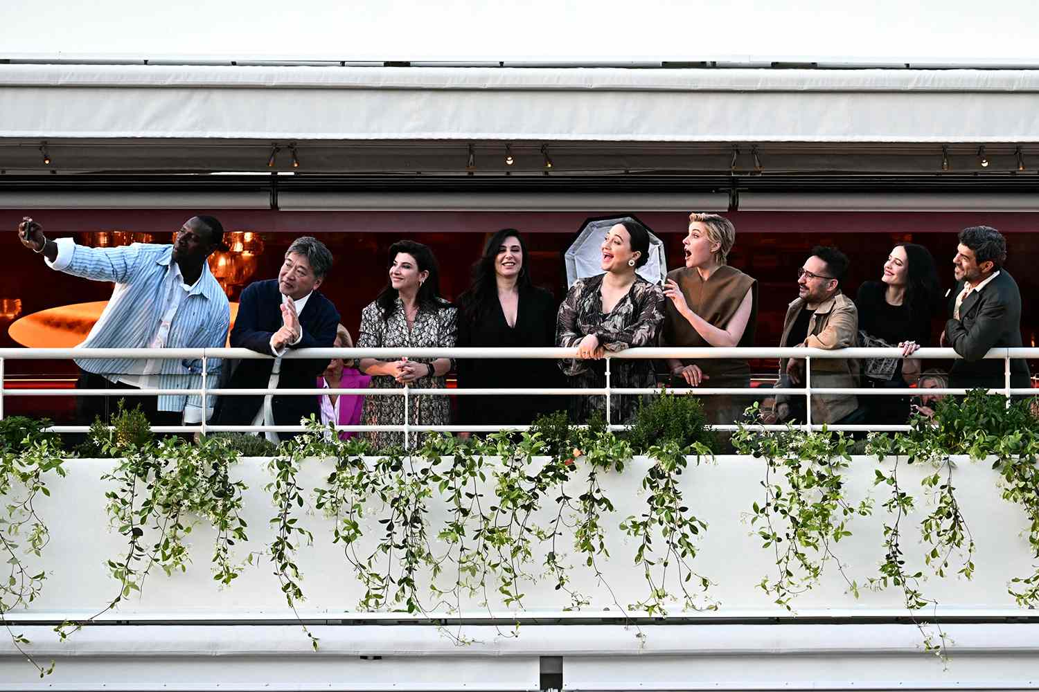 Greta Gerwig, Spanish director, producer, and writer Juan Antonio Bayona, French actress Eva Green and Italian actor Pierfrancesco Favino during a dinner of the jury at the Grand Hyatt Cannes Hotel Martinez, on the eve of the opening ceremony of the 77th edition of the Cannes