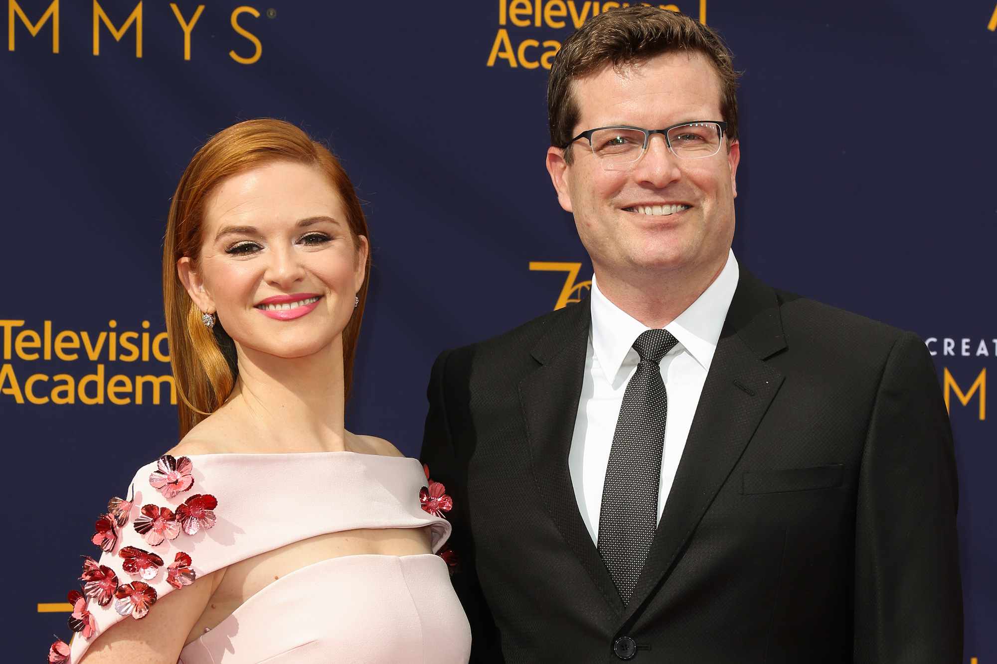 Actress Sarah Drew (L) and her Husband Peter Lanfer (R) attend the 2018 Creative Arts Emmy Awards - Day 1 at Microsoft Theater on September 8, 2018 in Los Angeles, California.