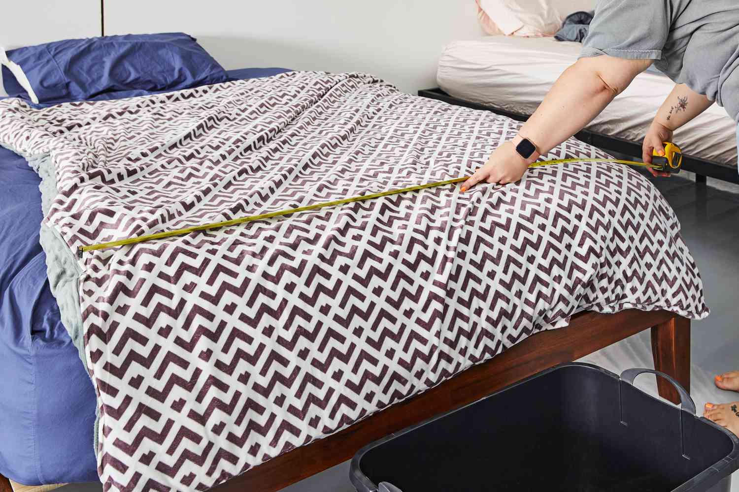 Quility Weighted Blanket with Soft Cover being measured