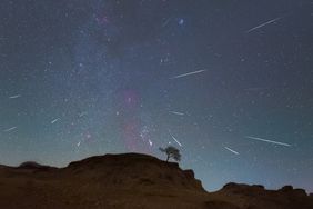 The Orionids meteor shower is seen over the Songhua River in Daqing City, Heilongjiang Province, China,