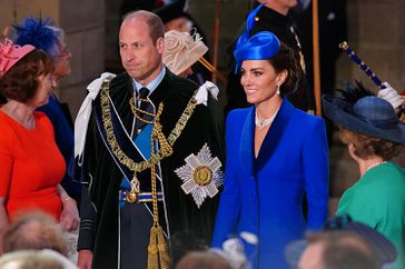 Prince William (L), Prince of Wales, and Britain's Catherine, Princess of Wales, arrive to a National Service of Thanksgiving and Dedication inside St Giles' Cathedral in Edinburgh 