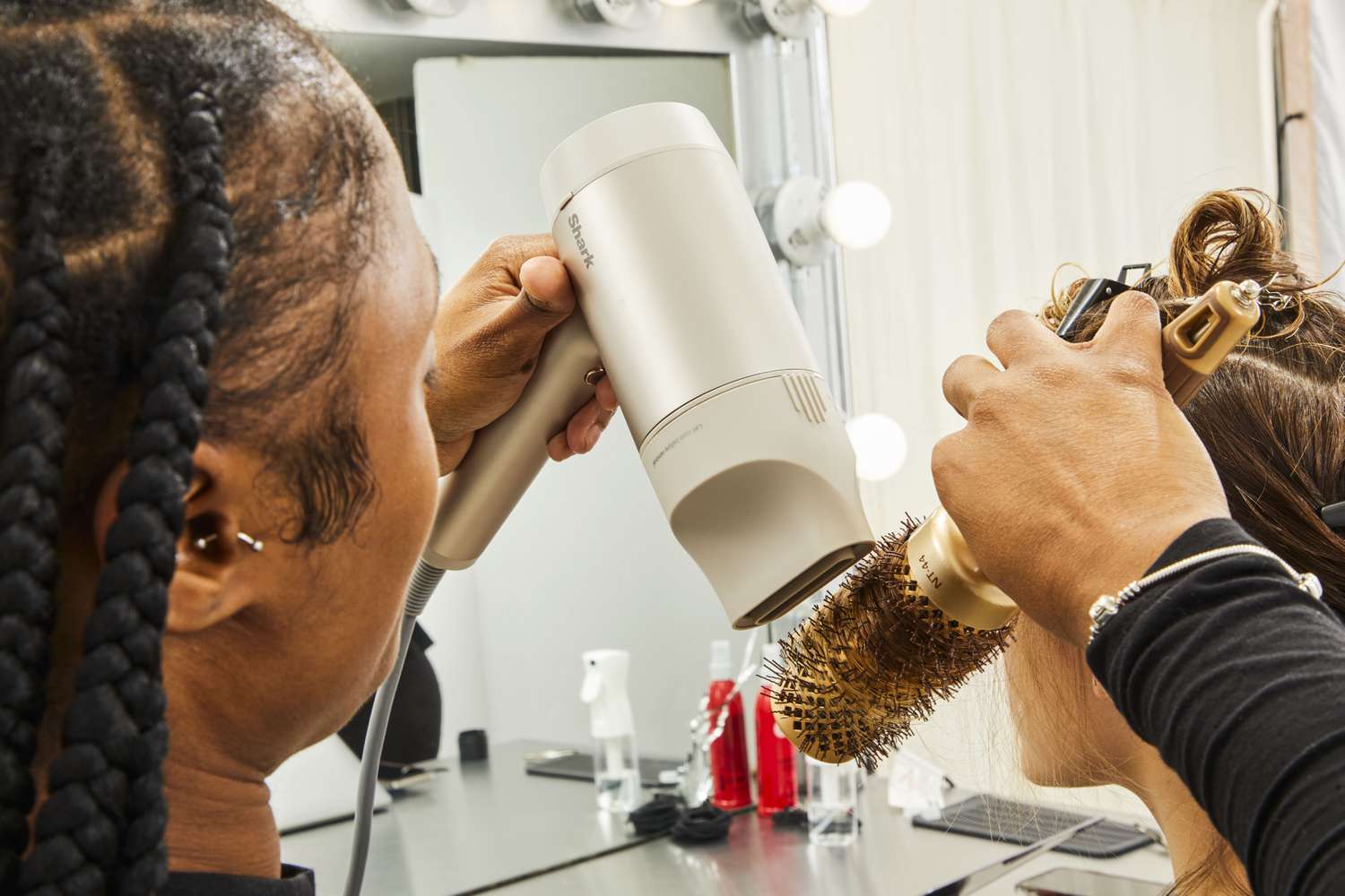 hands holding brush and Shark HyperAir Hair Dryer