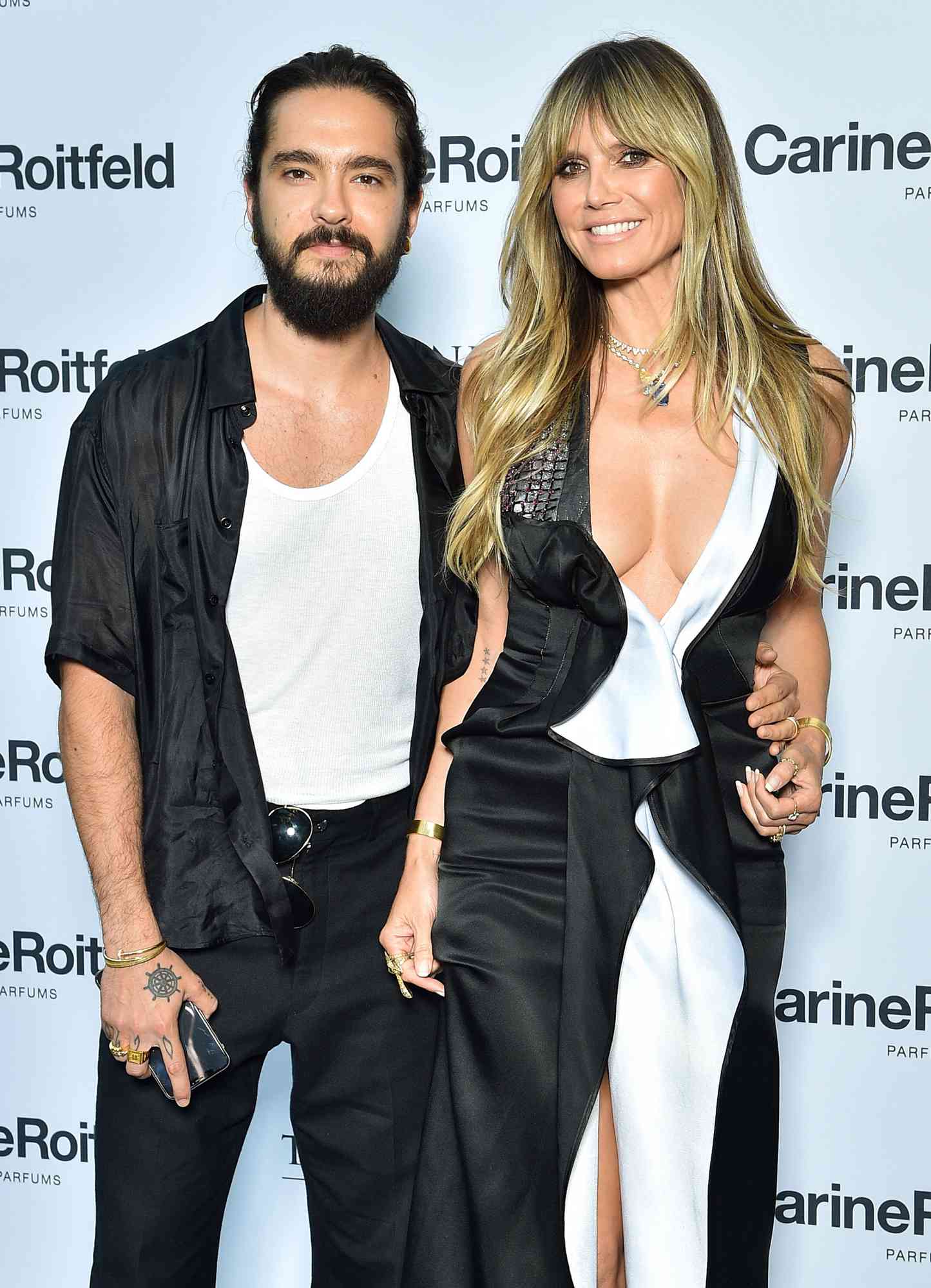 Tom Kaulitz and Heidi Klum attend the Carine Roitfeld Parfums "7 lovers" : Cocktail At The Peninsula Hotel In Paris on July 01, 2019 in Paris, France