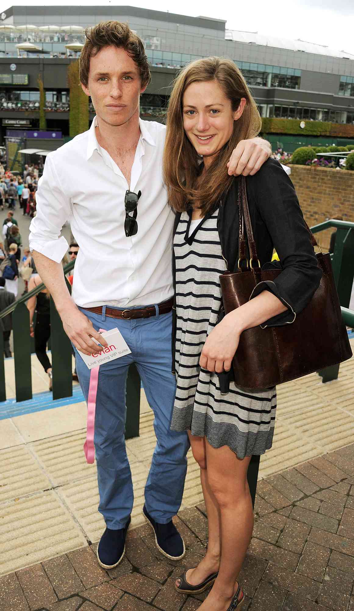 Eddie Redmayne (L) and Hannah Bagshaw attend the evian 'Live young' VIP Suite at Wimbledon on June 25, 2012 in London, England