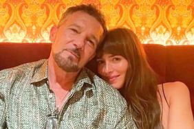 Antonio Banderas poses with Dakota Johnson