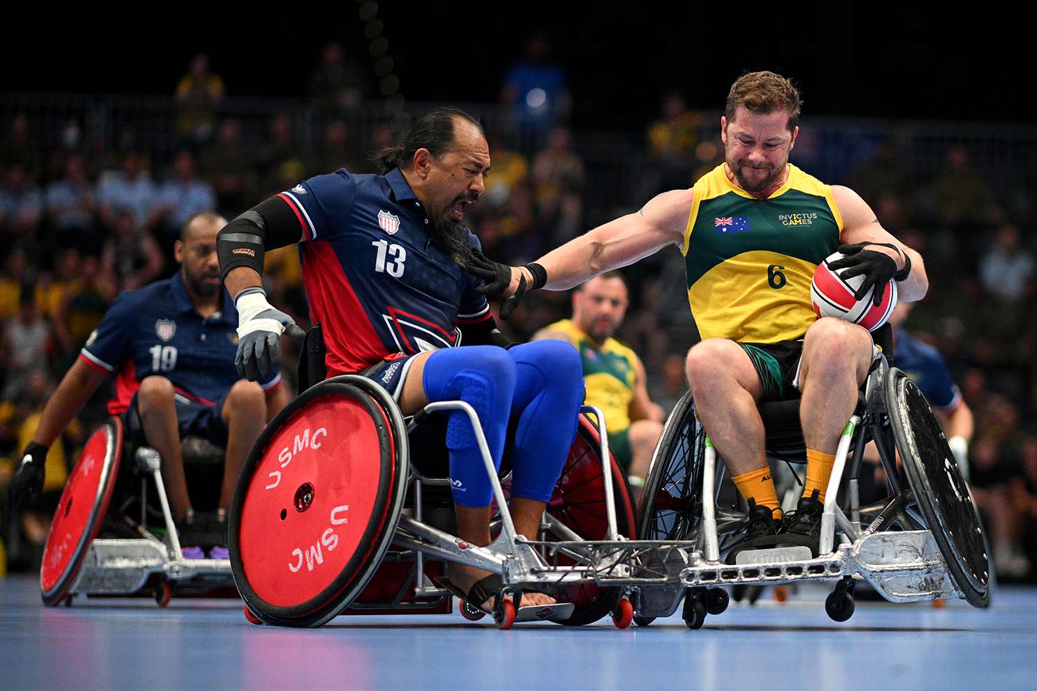 Garrett Kuwada of Team United States challenges Kurt Ludke of Team Australia for the ball in the Mixed Team Semi Final match between Team United States and Team Australia during day two of the Invictus Games 2023 on September 11, 2023 in Duesseldorf, Germany.
