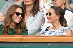 Catherine, Duchess of Cambridge and Pippa Middleton in the Royal Box on Centre Court during day twelve of the Wimbledon Tennis Championships at All England Lawn Tennis and Croquet Club on July 13, 2019 in London, England