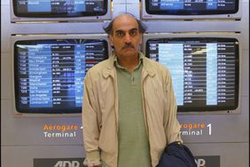 Charles de Gaulle airport: Merhan Karimi Nasseri, or "Alfred" as he prefers to be called , has lived..and survived in Roissy CGG airport for 15 years. Steven Spielberg has bought the rights to his life story for the new Tom Hanks vehicle, "The Terminal" Waiting for a departure. (Photo by Alexis DUCLOS/Gamma-Rapho via Getty Images)