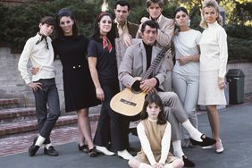 Dean Martin with his wife Jeanne and children (Gail, Craig, Claudia, Deana, Gina, Ricci and Dean Paul) pose for a family portrait in 1966 in Los Angeles, California