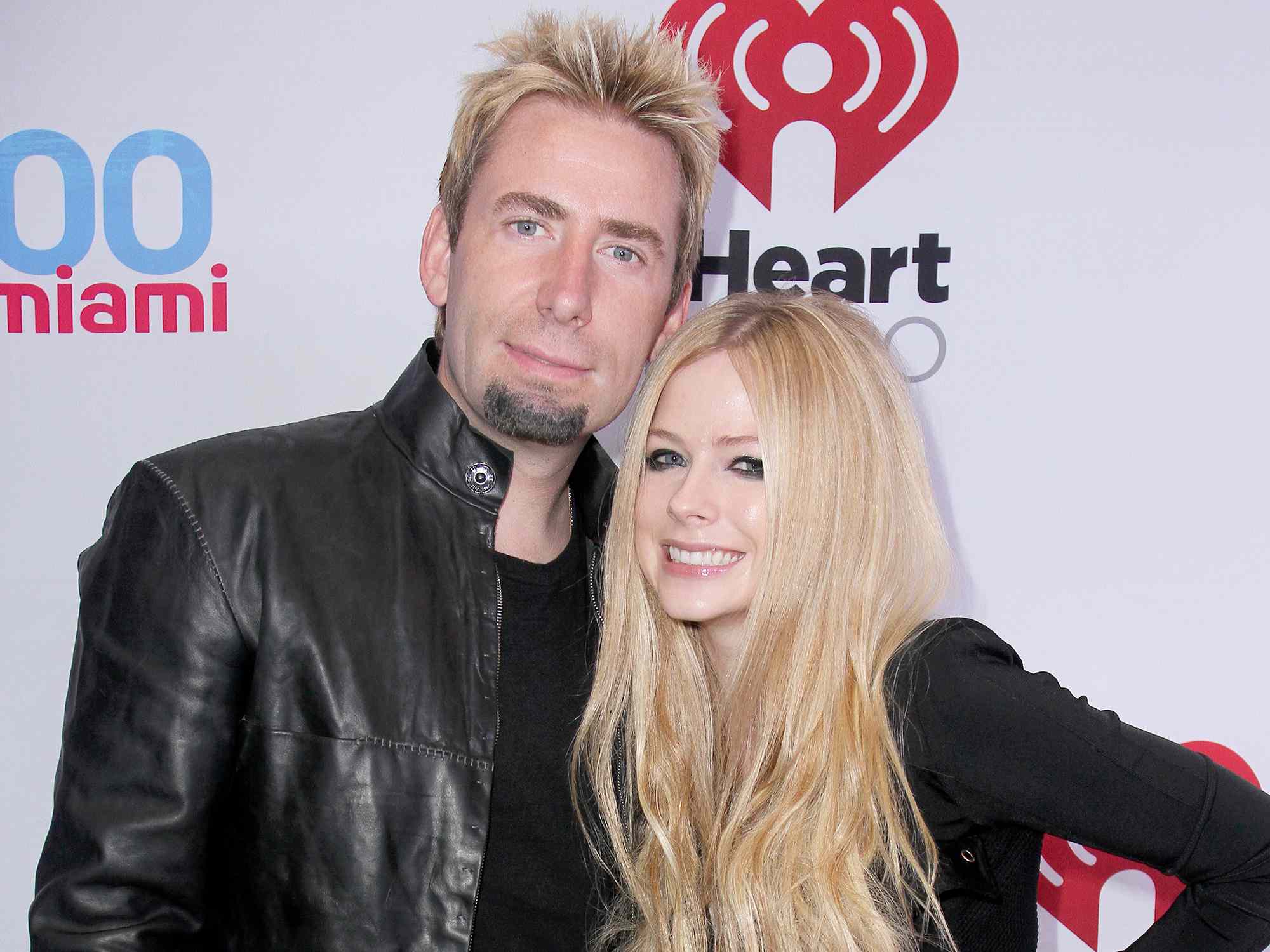 Chad Kroeger (L) and Avril Lavigne attend Y100s Jingle Ball 2013 Presented by Jam Audio Collection at BB&T Center on December 20, 2013 in Miami, Florida