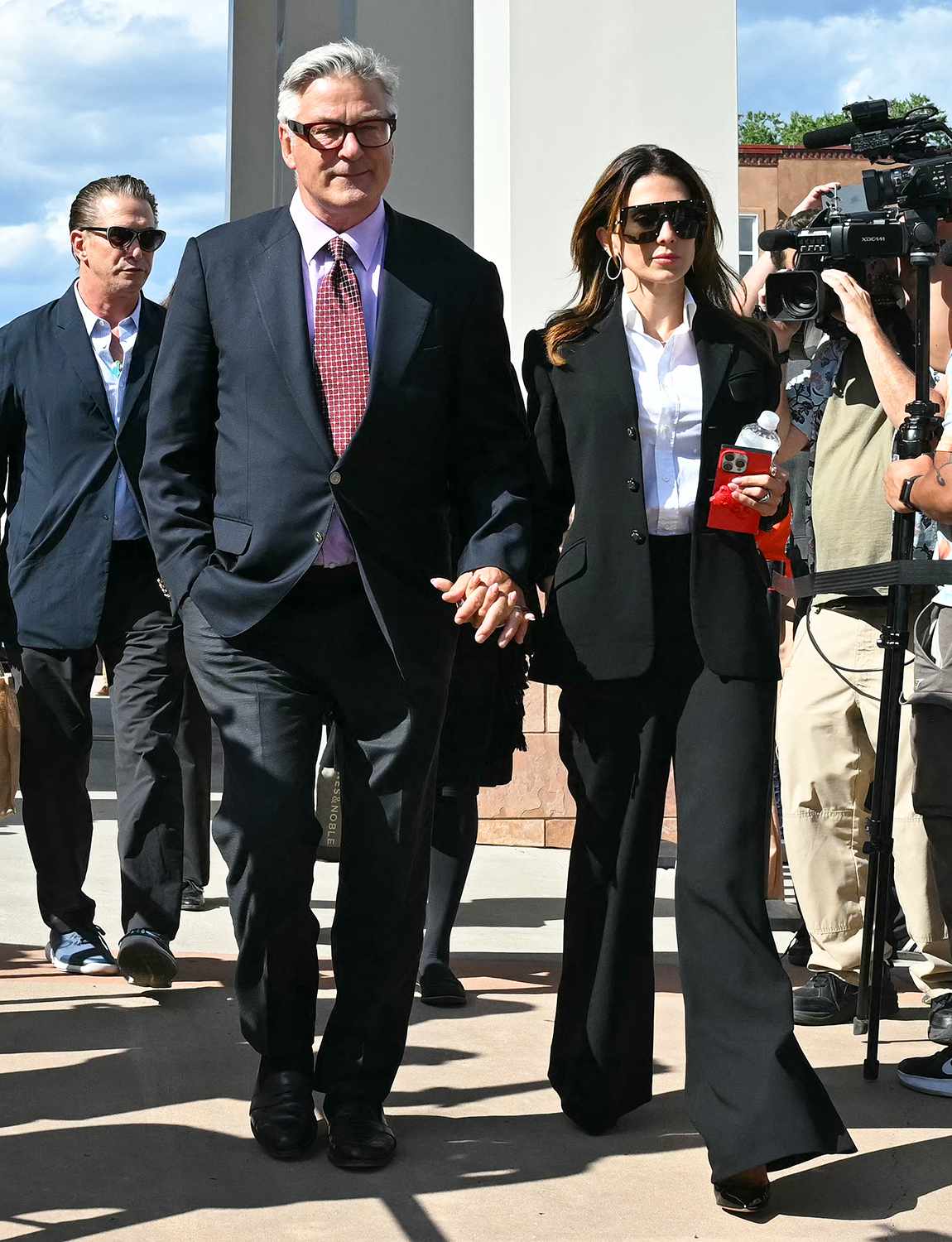 US actor Alec Baldwin and his wife Hilaria Baldwin leave the courthouse after the first hearing in his trial for involuntary manslaughter in Santa Fe, New Mexico, on July 10, 2024. Baldwin was accused of violating basic gun safety rules and playing "make believe" with a deadly weapon, as the Hollywood star's trial for involuntary manslaughter over a fatal shooting on the set of Western movie "Rust" began Wednesday