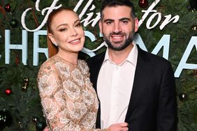 Lindsay Lohan and Bader Shammas at Netflix's Falling For Christmas Celebratory Holiday Fan Screening with Cast & Crew on November 9, 2022 in New York City.