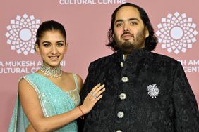 April 1, 2023, Anant Ambani (R) son of Indian businessman Mukesh Dhirubhai Amani, and his wife Radhika Merchant poses for pictures during the inauguration of the Nita Mukesh Ambani Cultural Centre