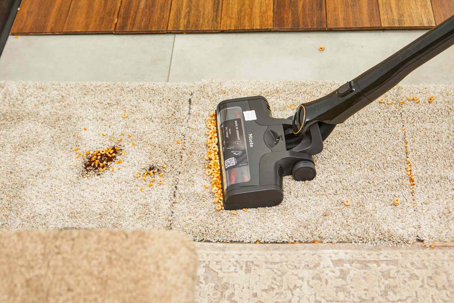 Miele Triflex HX2 Cat & Dog Vacuum cleaning food from carpeted floor 