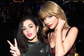 Charli XCX and Taylor Swift pose backstage at iHeartRadio Jingle Ball 2014, hosted by Z100 New York and presented by Goldfish Puffs at Madison Square Garden on December 12, 2014 in New York City.