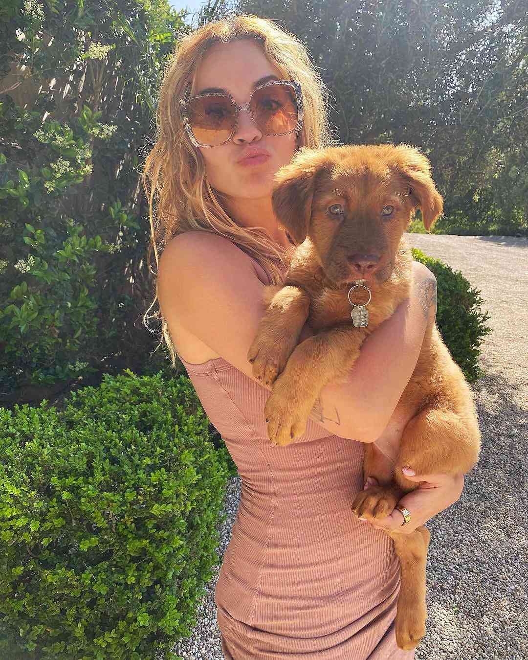 Rita Ora Cuddles with Her New Rescue Dog