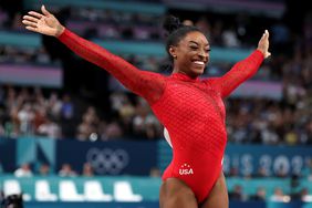 Simone Biles of Team United States celebrates after finishing her routine during the Artistic Gymnastics Women's Vault Final on day eight of the Olympic Games Paris 2024 at Bercy Arena on August 03, 2024 in Paris, France