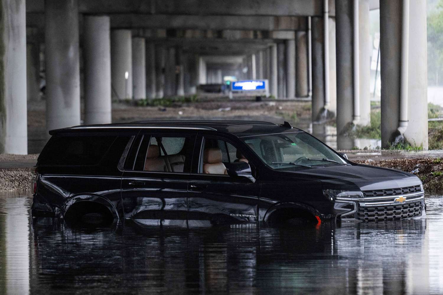 An abandoned car sits in flood waters near the Fort Lauderdale-Hollywood International Airport in Fort Lauderdale, Florida, on June 13, 2024