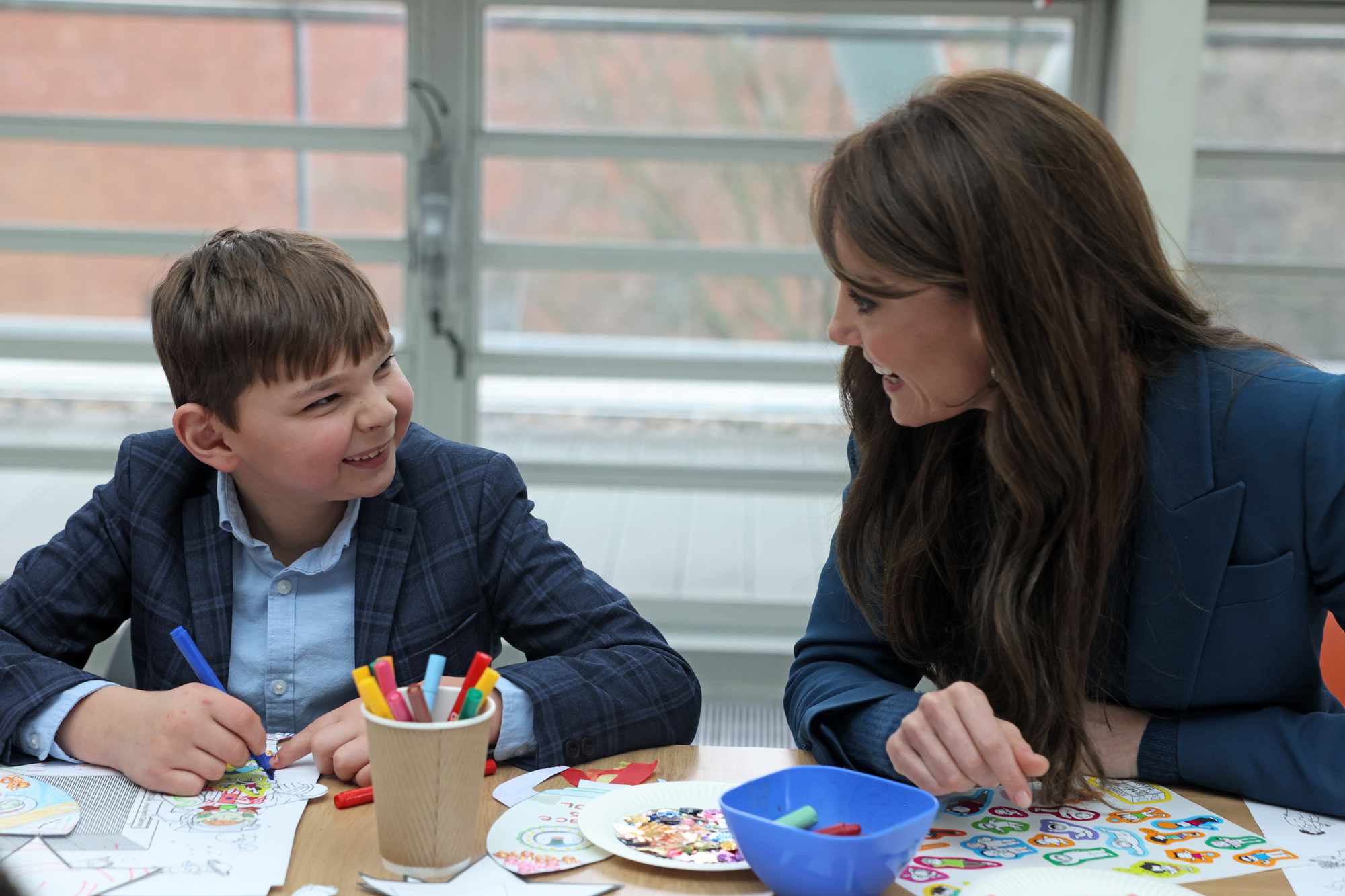 Catherine, Princess Of Wales is seen meeting Tony Hudgell who has raised over a million pounds for the hospital at the opening event of Evelina London's new children's day surgery unit on December 5, 2023