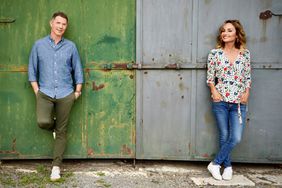 Bobby Flay and Giada De Laurentiis pose on the grounds of Tenuta Astrone in Tuscany