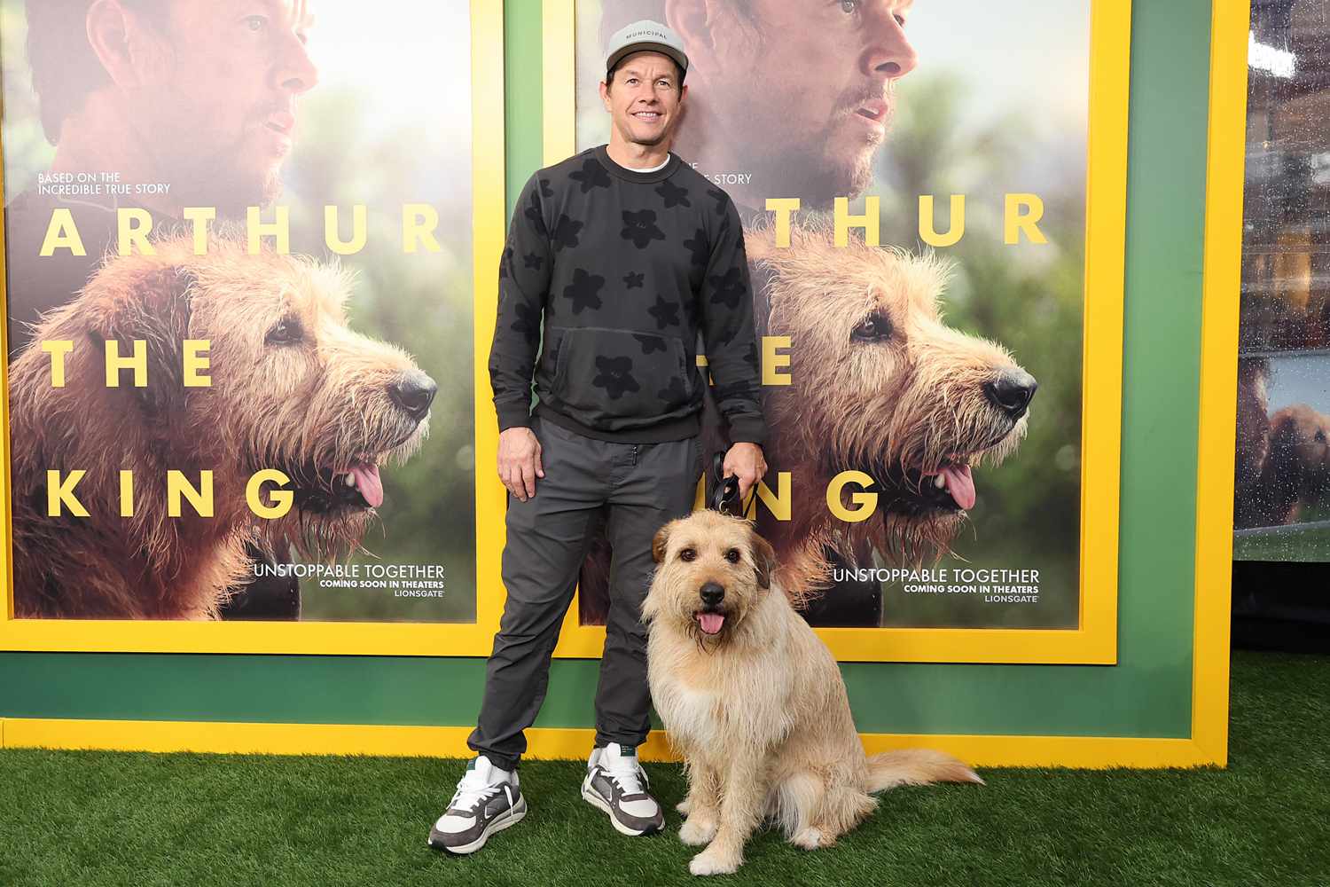 Mark Wahlberg and Ukai attend a Los Angeles special screening and adoption event for Lionsgate's "Arthur The King" at AMC Century City 15 on February 19, 2024 in Los Angeles, California