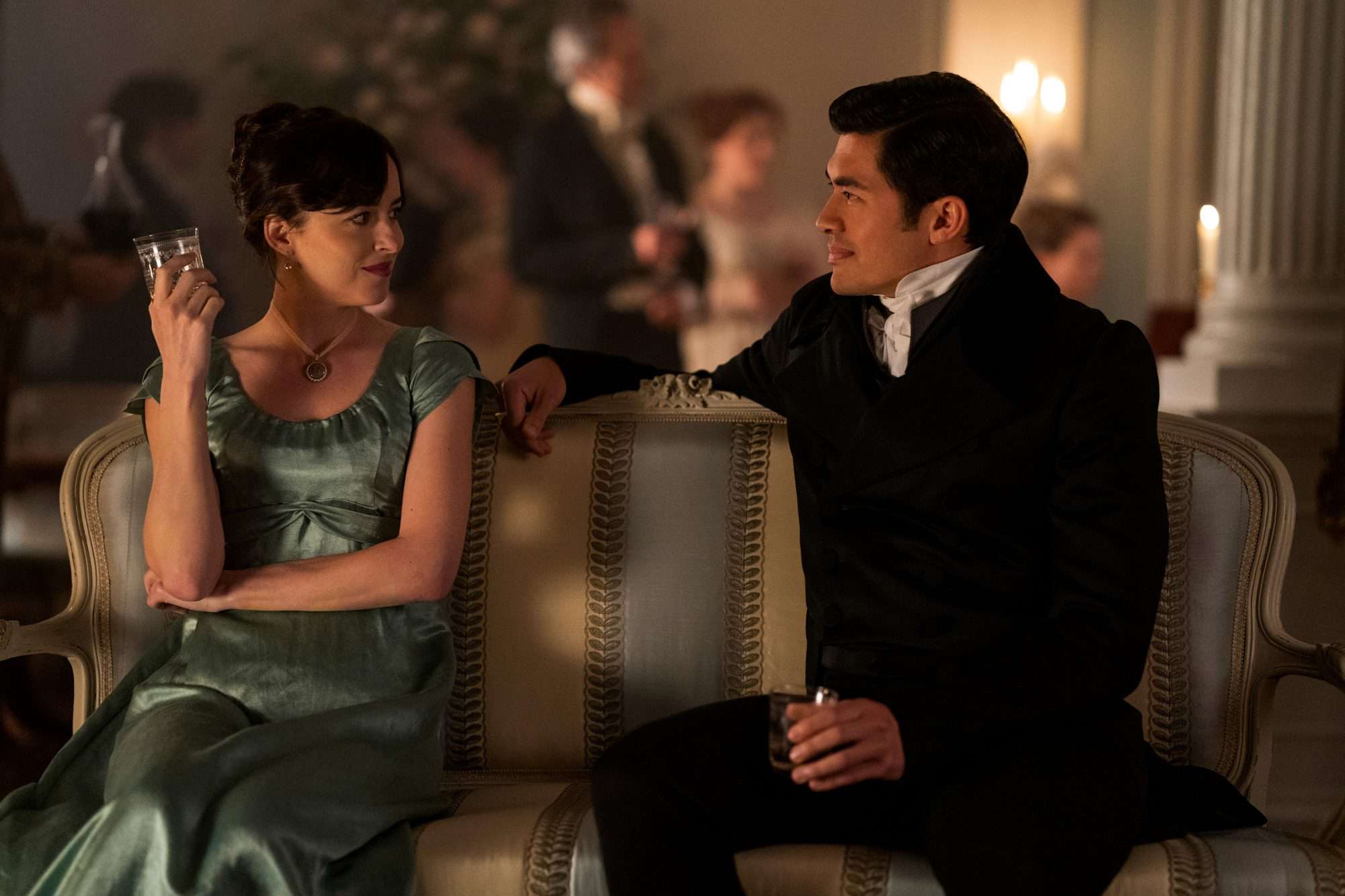 Persuasion. (L to R) Dakota Johnson as Anne Elliot, Henry Golding as Mr. Elliot in Persuasion. Cr. Nick Wall/Netflix © 2022