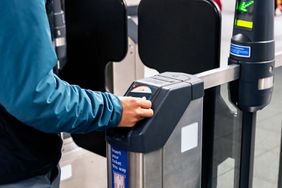 Man contactless pays for his fare on the London Underground