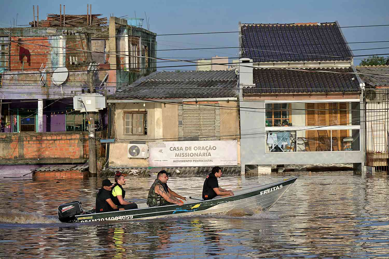 Rescuers sail by boat looking for people at the Humaita neighbourhood in Porto Alegre, Rio Grande do Sul state, Brazil, on May 7, 2024. 