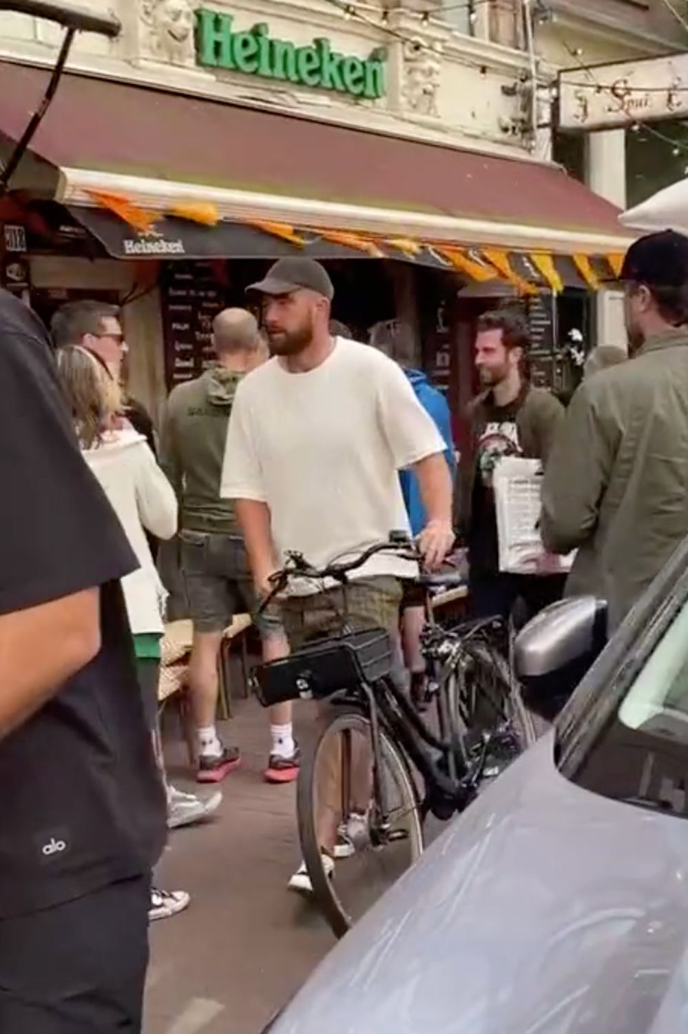 Travis Kelce Riding a bike in Amsteram