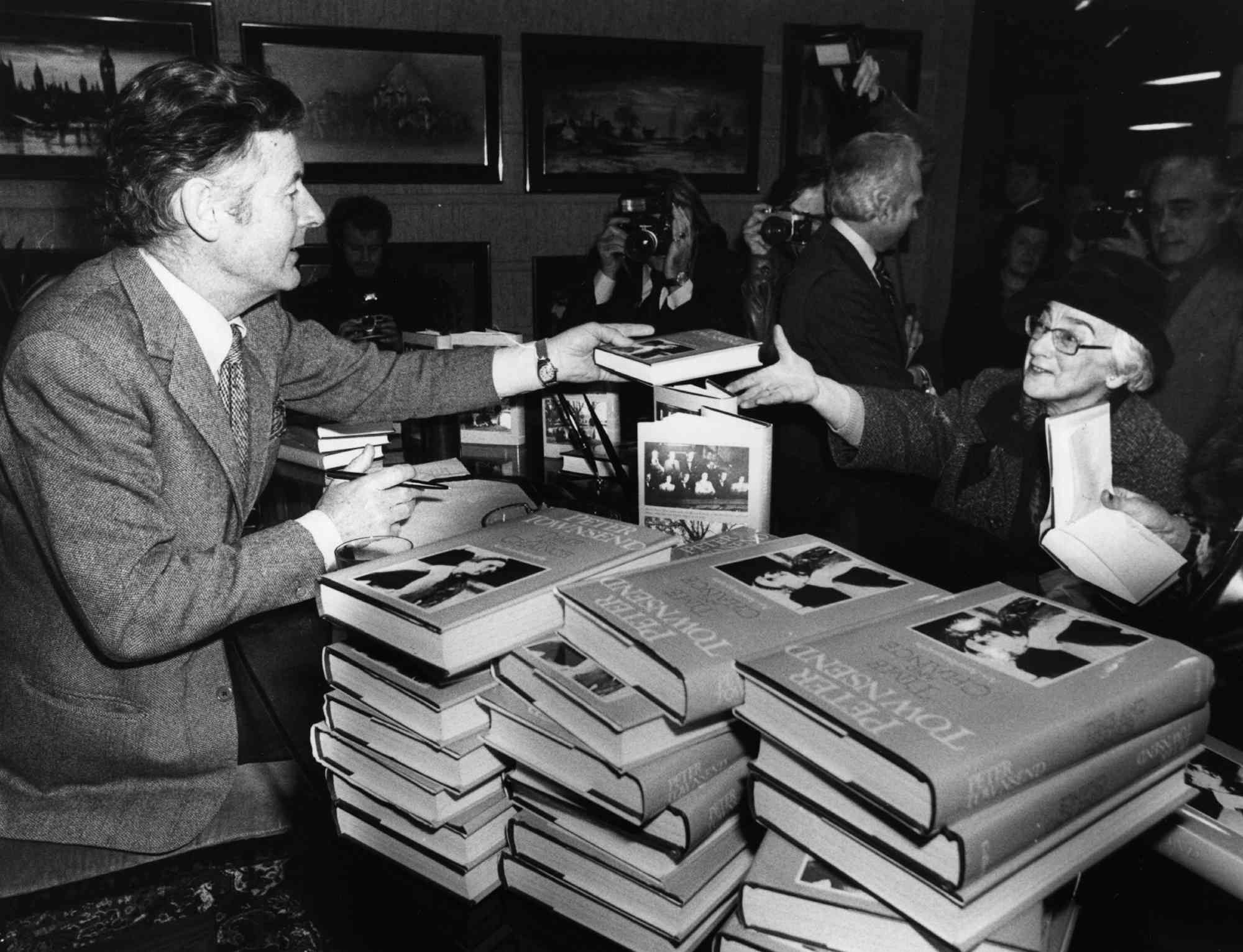 Peter Townsend, the former King's equerry, signing his autobiography 'Time and Chance', at Selfridges. In the book he relates his association with Princess Margaret