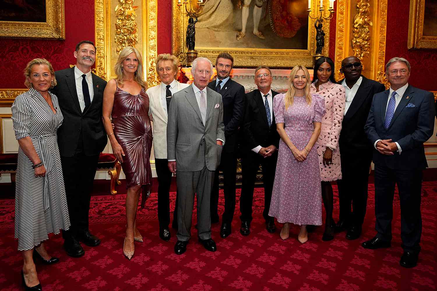 Britain's King Charles III (C) poses with the presenters of the inaugural King's Foundation charity awards at St James' Palace, in central London, on June 11, 2024. The presenters include British singer Rod Stewart (4th L), English former football player David Beckham (6th R), British actress Sienna Miller (4th R), British model Naomi Campbel (3rd R) and British Vogue's Global Creative and Cultural Advisor Edward Enninful 