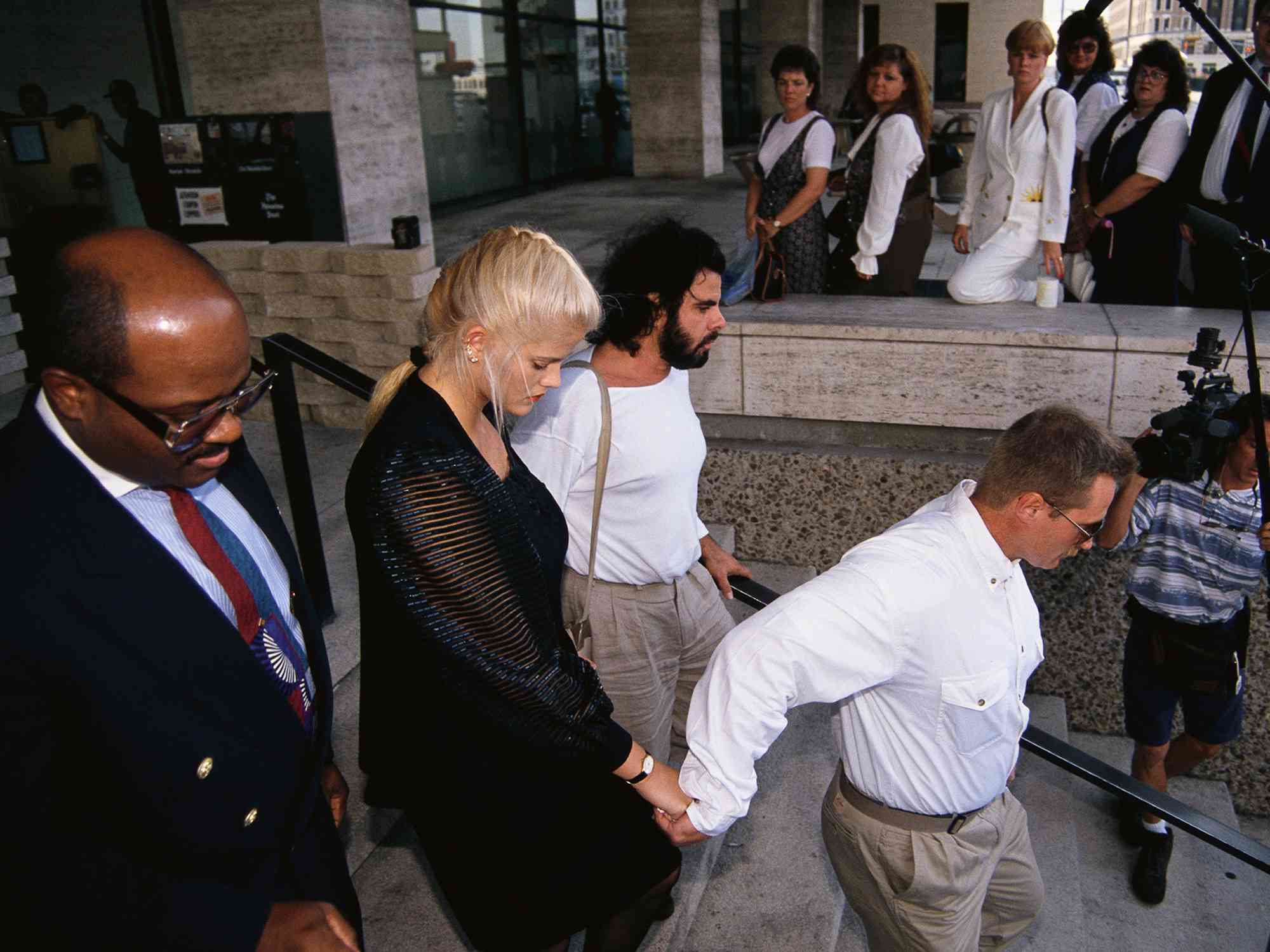 Anna Nicole Smith leaves a Houston courthouse after legal actions involving the will of her late husband, millionaire J. Howard Marshall