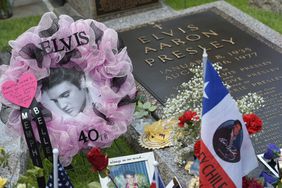 Tributes and momentoes are seen next to the marker for Elvis Presley in the Meditation Garden where he is buried alongside his parents and grandmother at his Graceland mansion on August 12, 2017 in Memphis, Tennessee. Elvis Presley, American icon and King of rock n roll, transformed popular culture, sold over a billion records and is idolized as ever on the 40th anniversary of his tragic death. His Graceland mansion in Memphis, Tennessee -- the second most famous home in the United States after the White House -- expects more than 50,000 people to descend for the biggest ever annual celebration of his life 40 years after his death aged 42 on August 16, 1977. / AFP PHOTO / Mandel Ngan / With AFP Story by Jennie MATTHEW: Elvis: 40 years since the death of an American icon (Photo credit should read MANDEL NGAN/AFP via Getty Images)