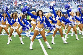 Dallas Cowboy cheerleaders perform before a game against the Chicago Bears at AT&T Stadium on October 30, 2022 in Arlington, Texas.