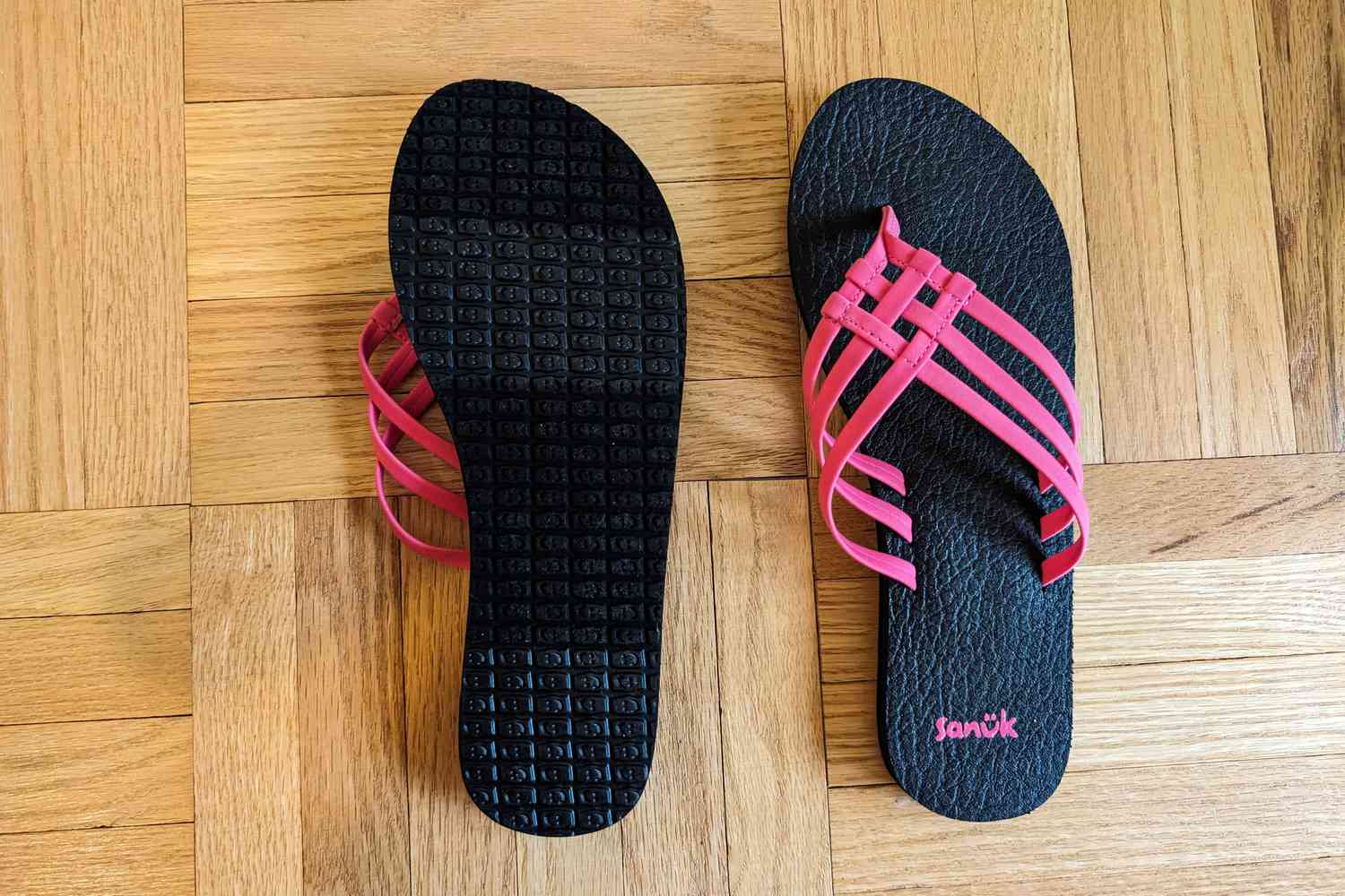 Sanuk Yoga Sandy Sandals on floor with one flipped over and one flat