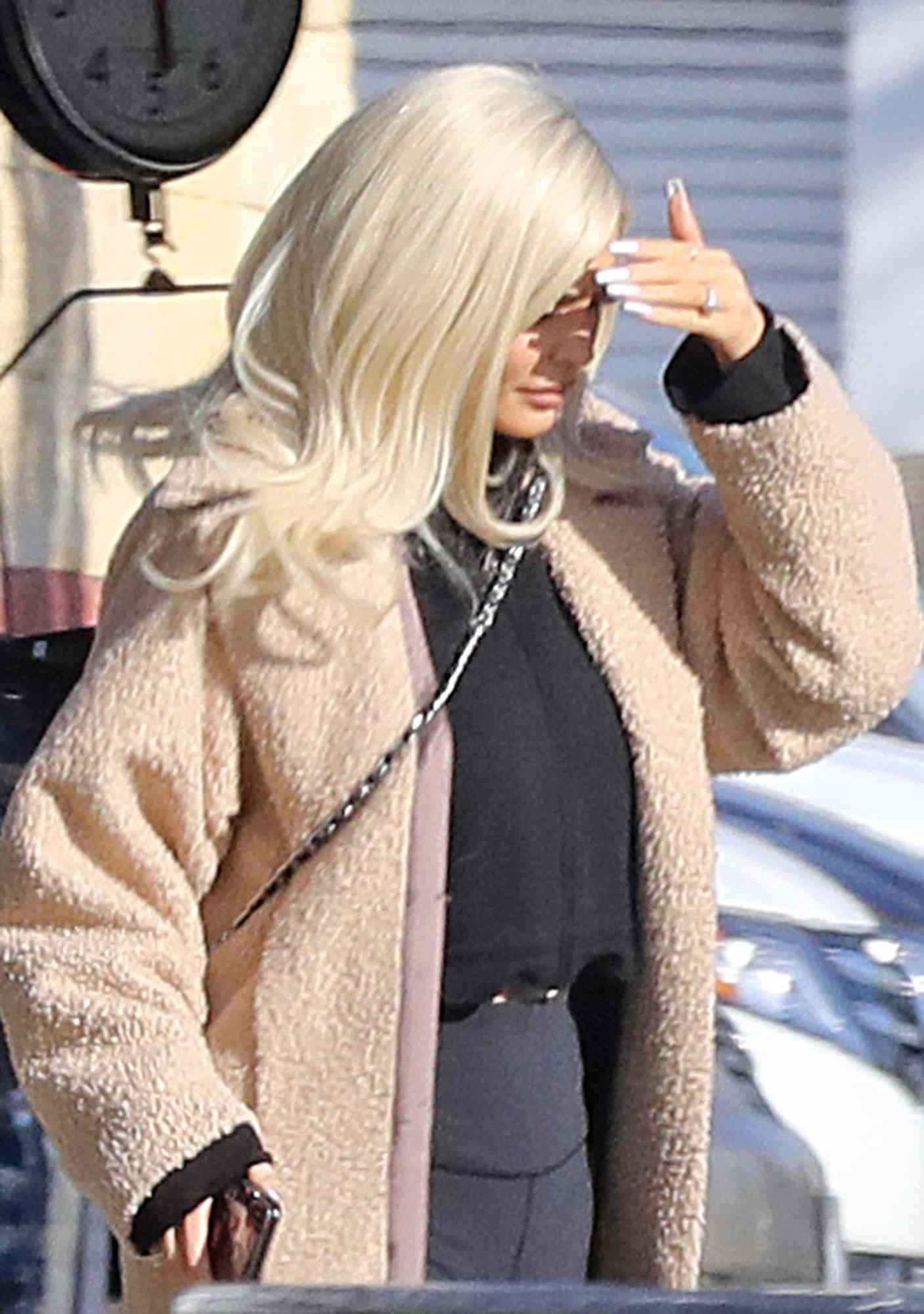 Kylie Jenner continues to fuel rumors she&rsquo;s engaged to Travis Scott as she steps out with a diamond ring on her wedding finger.