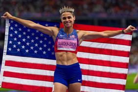 Sydney McLaughlin-Levrone of Team United States celebrates winning with the new World Record after competing in the Women's 400m Hurdles Final on day thirteen of the Olympic Games Paris 2024 at Stade de France on August 08, 2024