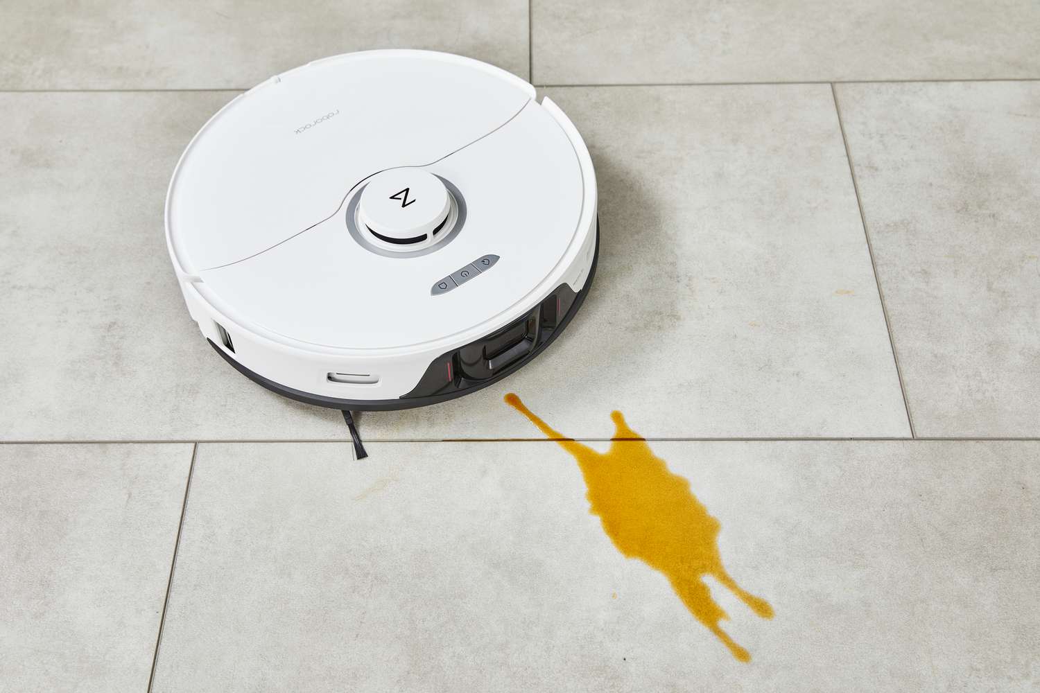 The Roborock S8 Pro Ultra cleans up a liquid spill on a tile floor