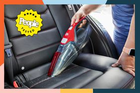 Person using Dirt Devil SD30025B Scorpion Plus Corded Handheld Vacuum Cleaner to clean car seat