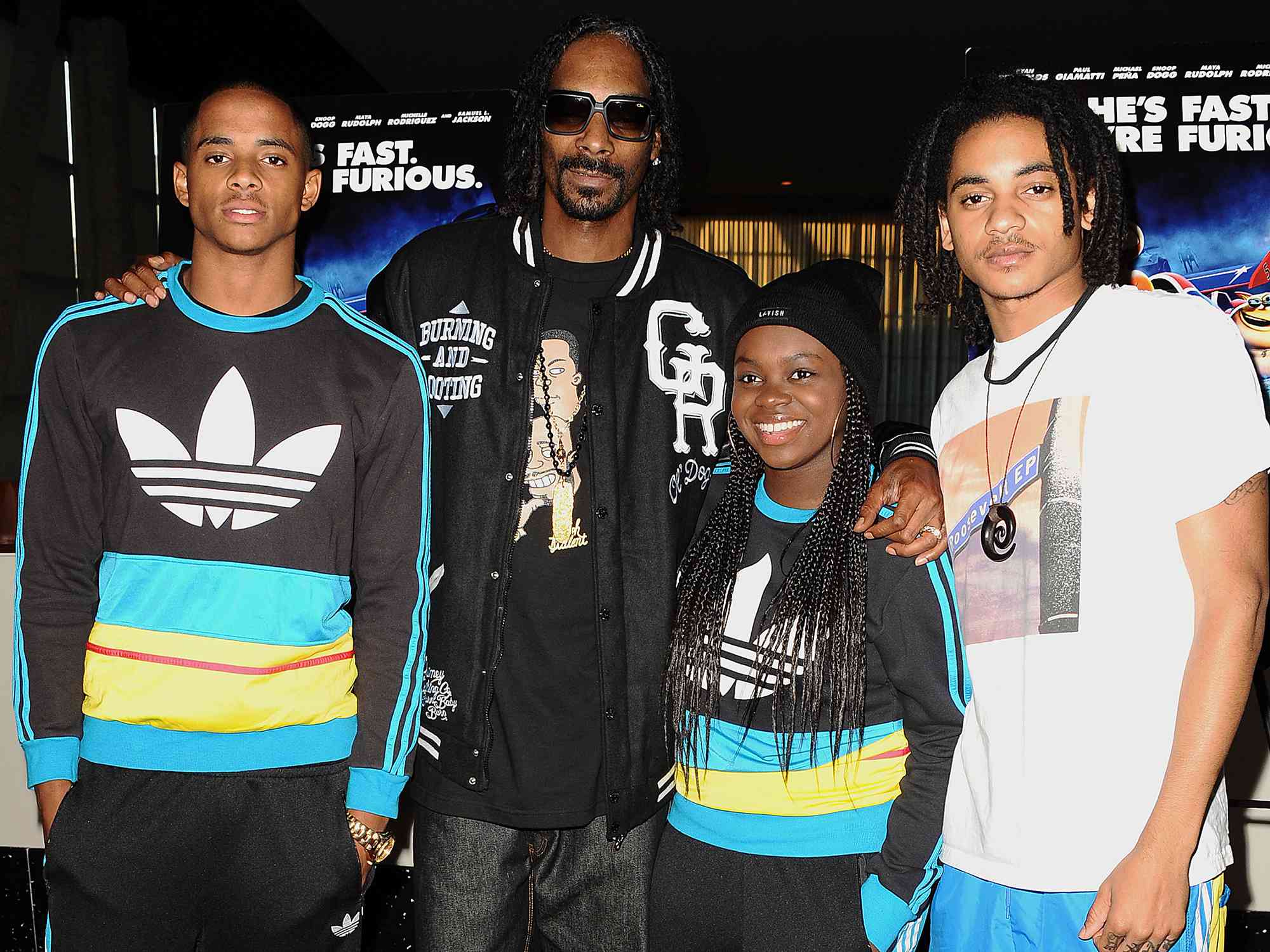 Snoop Dogg, Cordell Broadus, Cori Broadus and Corde Broadus attend a screening of "Turbo" on July 16, 2013 in Hollywood, California. 